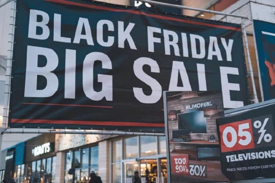 Outdoor PVC banner promoting a retail offer