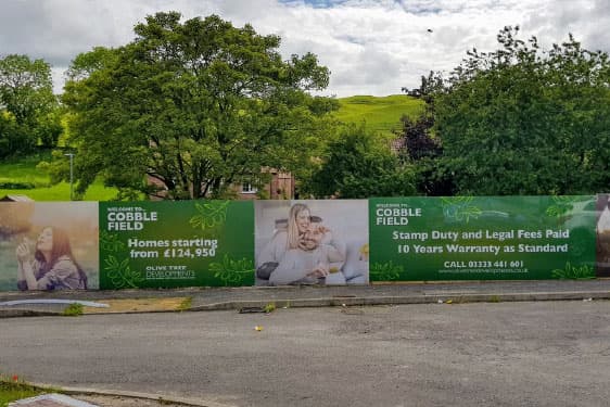 Printed hoarding panels around a development site